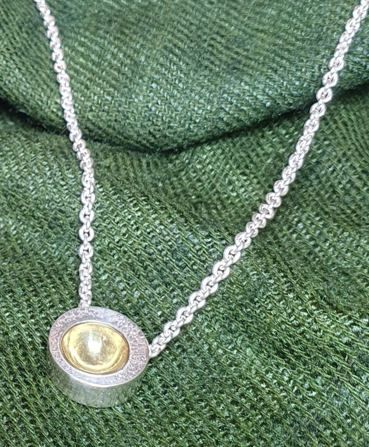 Orbit pendant, textured silver with gold cup. #BarbaraSpenceJewellery 